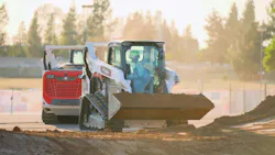 Bobcat compact track loaders pass each other carrying dirt. Quite a trick.