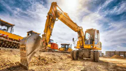 LiuGong wheeled excavator about to dig some dirt.