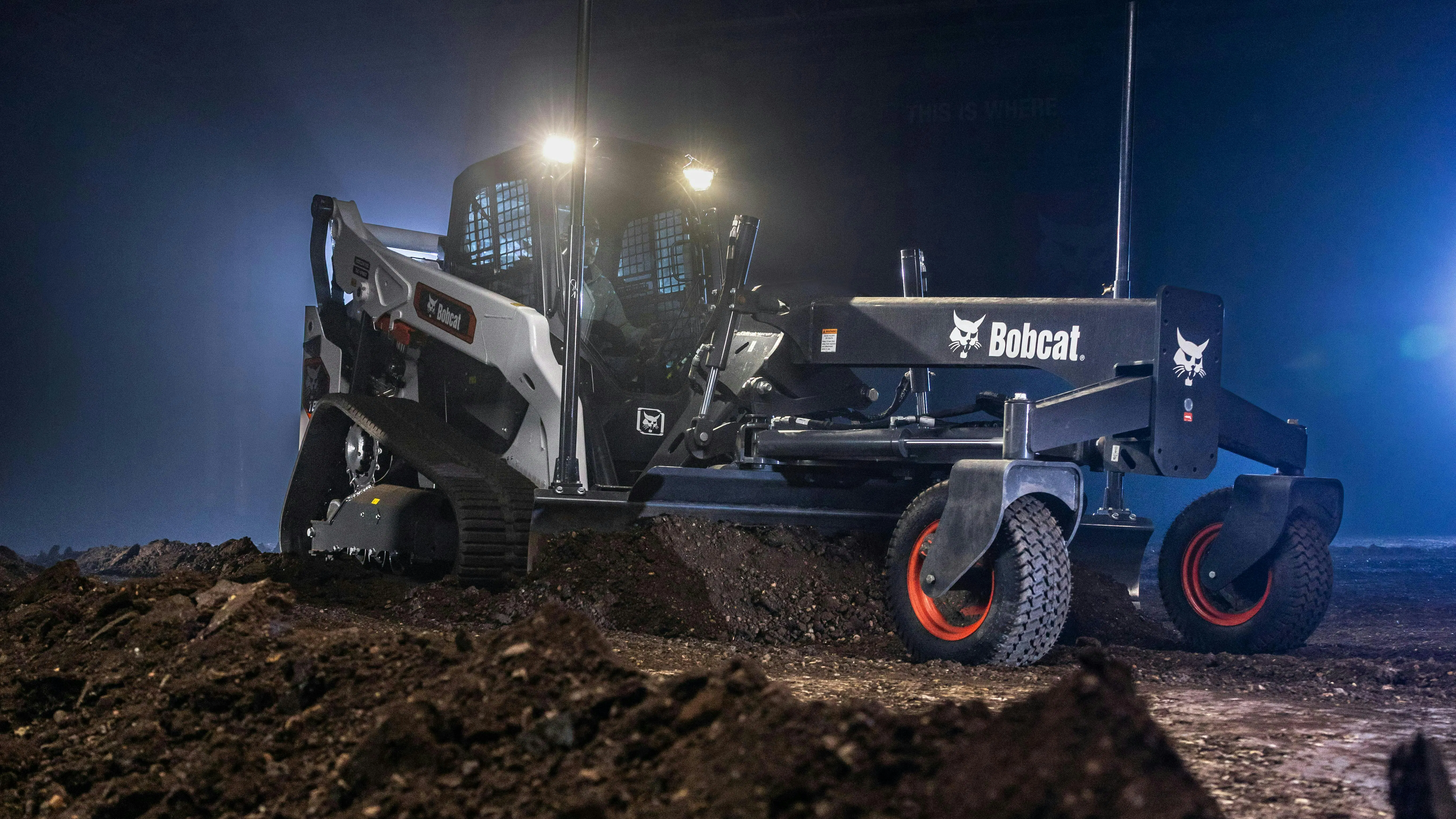Bobcat compact track loader with a grading attachment and grade control.