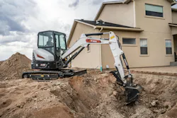 Bobcat E35 compact excavator digging in the dirt.