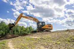 Case Construction Equipment CX220E excavator digging near a forest.