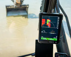 Topcon MC-Max grade control system on an excavator digging in water.