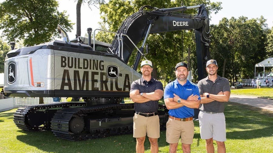 John Deere Building America Contest. Three finalists stand in from of a John Deere excavator.