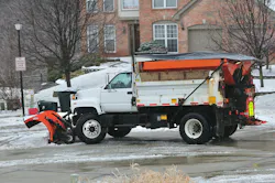 Kentucky Snow Plow. A snow plow cleaning the road in a suburban neighborhood in Kentucky, USA