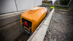 Ammann remote-control trench roller. An operator controls from behind.