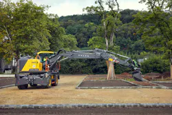 Volvo Construction Equipment wheeled excavator EWR170. reaching long to dig.