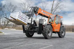 JLG Skytrak 12054 telehandler carrying some pallets.