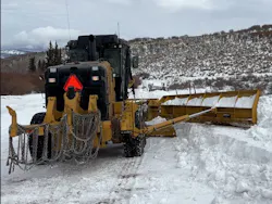 Caterpillar snow wing on a grader.