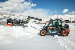 Bobcat Snowpusher Pro on a telehandler, working a pile.