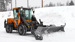 Hilltip SnowStriker SFT Flex box plow on a wheel loader pushing snow.