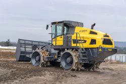 Bomag's BC 573-8 compactor sitting in the dirt.