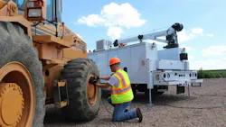VMAC hydraulic air compressor on a crane truck working on a wheel loader