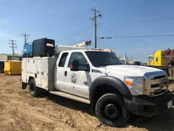 VMAC diesel compressor service truck sitting in the dirt.
