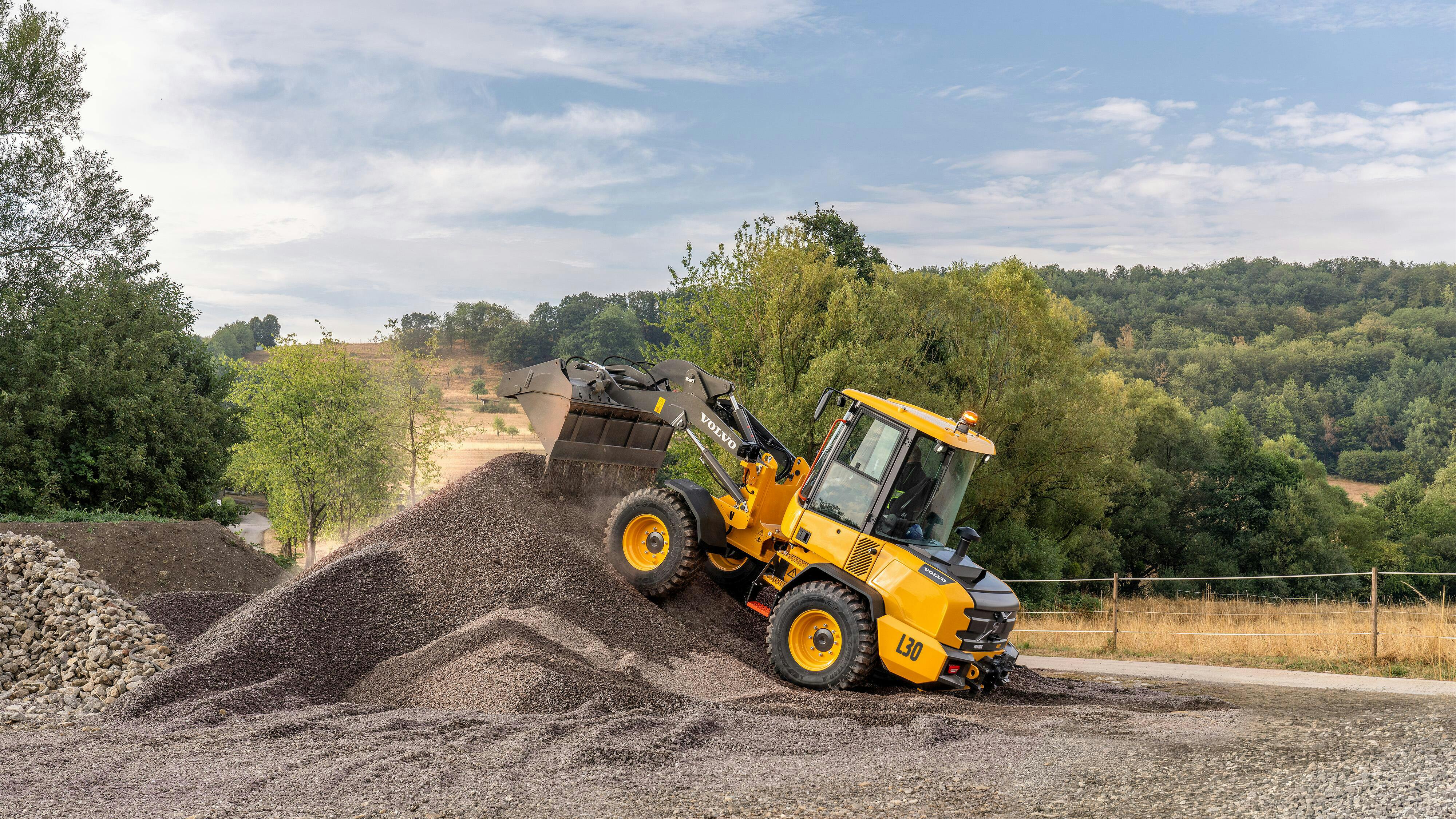 Volvo loader climbs pile