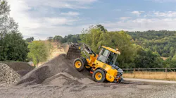 Volvo loader climbs pile