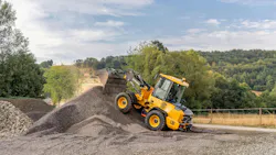 Volvo loader climbs pile