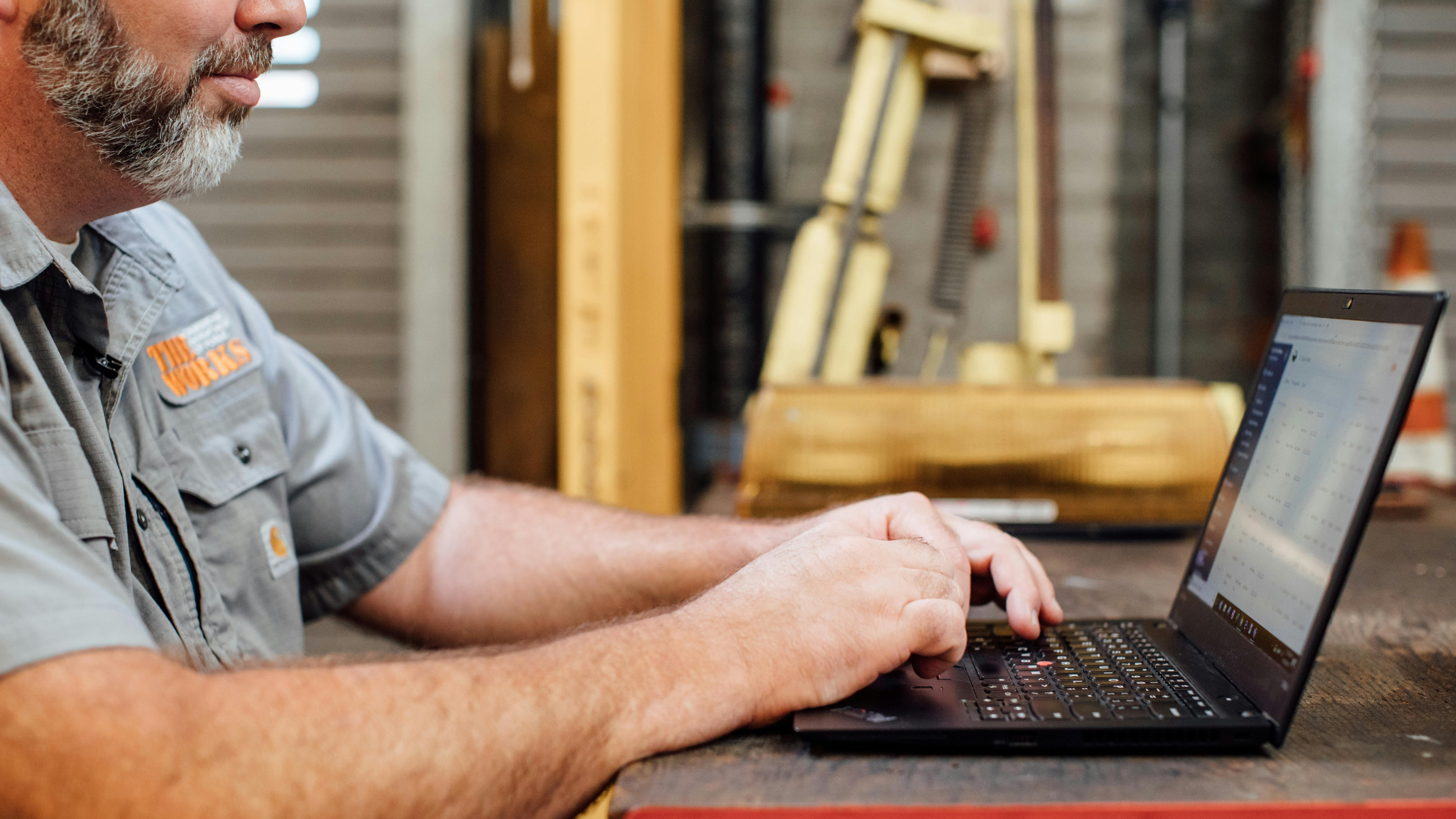 Fleetio Customer with Laptop