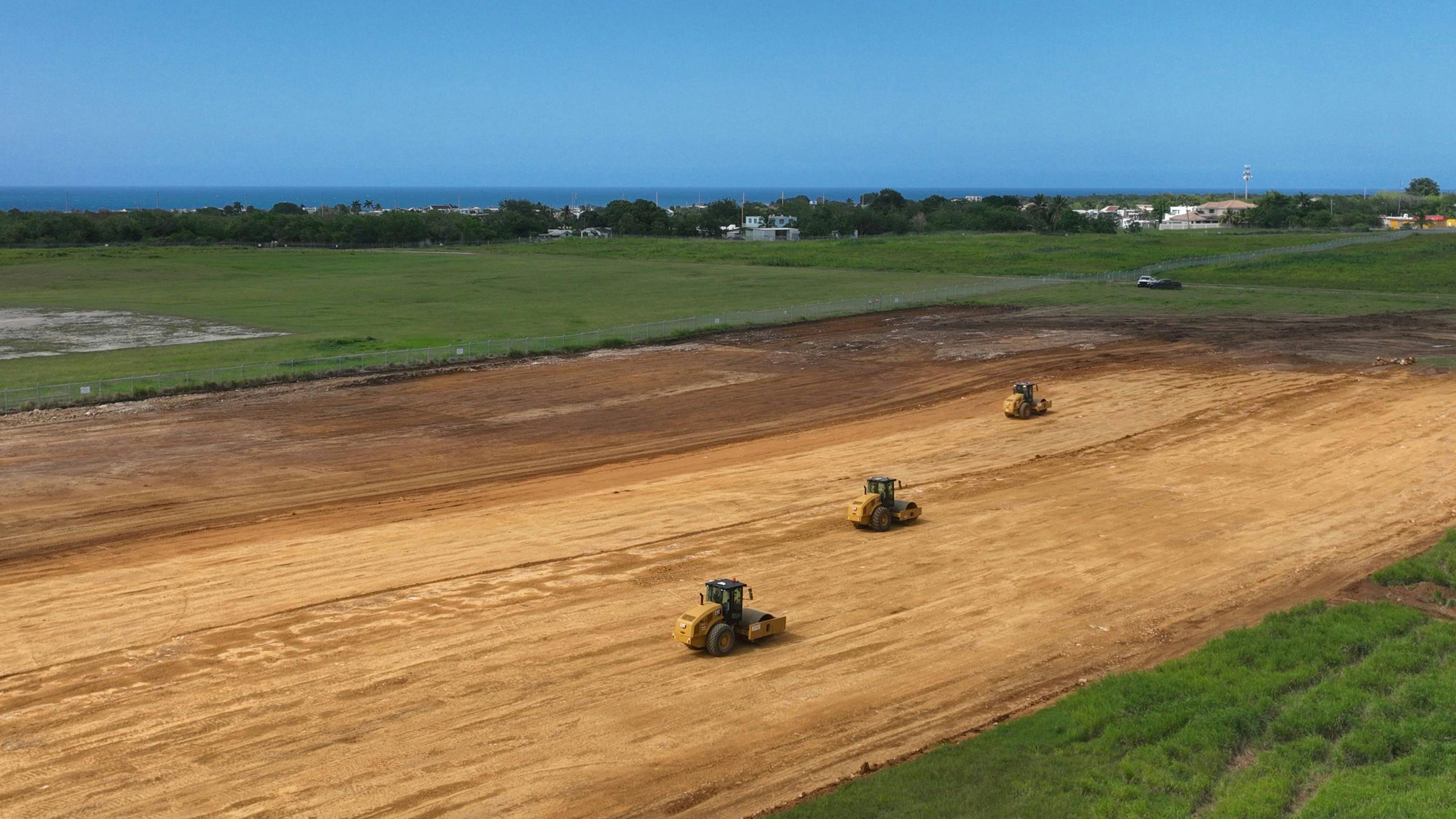 Rollers construct airport runway