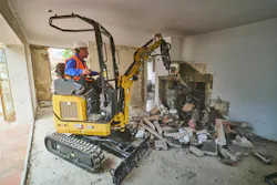 Cat 301 mini excavator doing indoor demo work