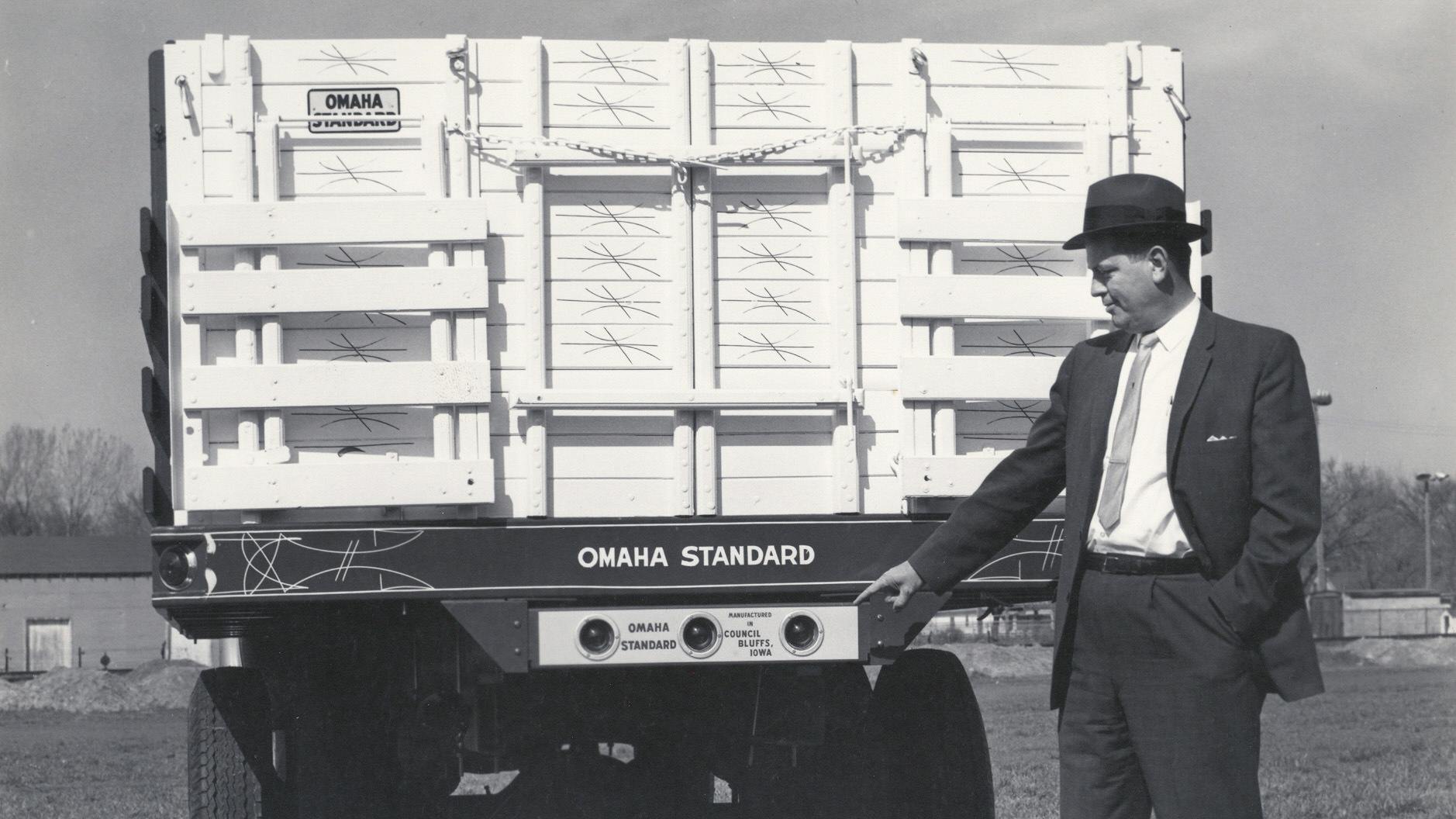 A dapper man shows off an Omaha Standard truck body and the company&rsquo;s Council Bluff roots.