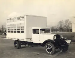 An early Omaha Standard truck body combines enclosed cargo space with open slatted sections for ventilation.