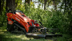 Ignite 44-inch Mini Brush Cutter on a Kubota mini skid steer, sitting in the woods.