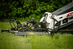 Ignite Attachments 44-inch Mini Brush Cutter on a Bobcat mini skid steer, sitting in a pasture.