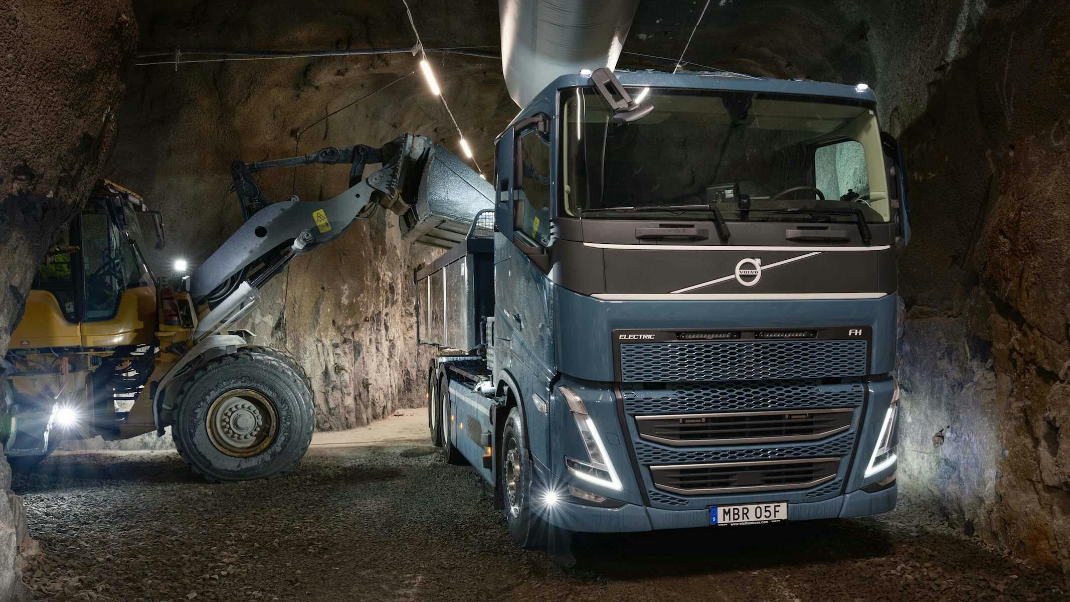 Volvo loader and truck in mine