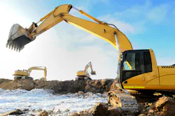 A group of three excavators operators in the cold.