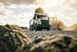 A wheel loader dumps into a Volvo Trucks VNX 300 dump truck.